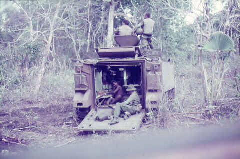 Wounded Prisoner in the back of 22 with Capt Murphy sitting on top