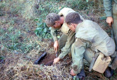 Engineers disarming an anti-tank mine narrowly avoided by 2 Troop tanks on the previous night. The mine consisted of an unexploded 155mm shell and 12 pounds of explosives.